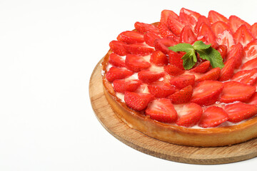 Round board with strawberry tart isolated on white background