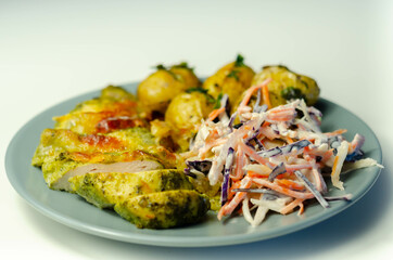 Pesto and mozzarella chicken breast fillet with herby baby potatoes and creamy coleslaw salad