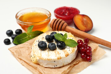 Concept of tasty food with grilled camembert on white background