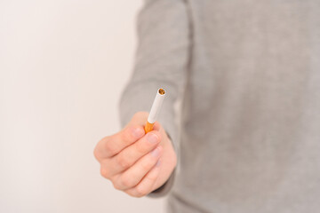 A man offers to smoke a cigarette. Stop cigarette.