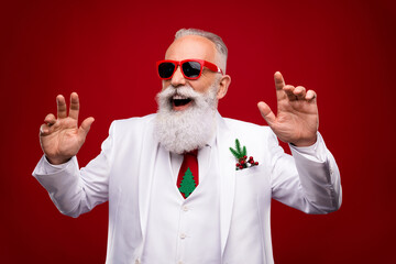 Fototapeta na wymiar Photo of positive happy grey haired cheerful man look empty space dance clubber christmas isolated on red color background