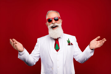 Photo of cheerful positive happy old man wear sunglass good mood showman new year isolated on red...