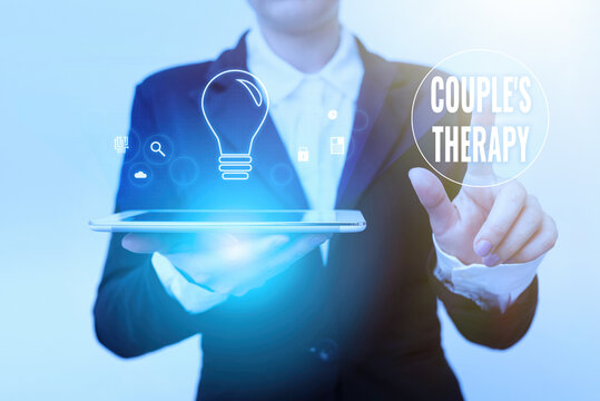 Text Caption Presenting Couple S Therapy. Word For Treat Relationship Distress For Individuals And Couples Woman In Suit Holding Tablet Pointing Finger On Futuristic Virtual Button.