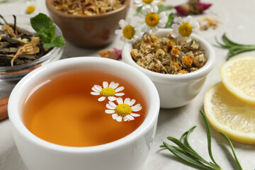 Cup of fresh aromatic chamomile tea, closeup