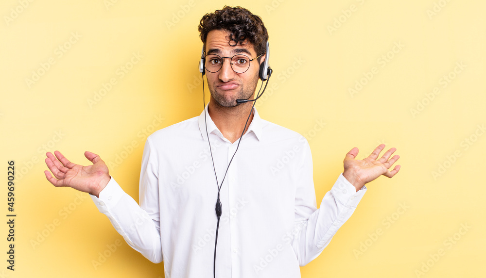 Wall mural hispanic handsome man feeling puzzled and confused and doubting. telemarketer concept