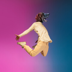 Contemporary collage with young man, hip hop dancer headed of dog's head dancing isolated over...