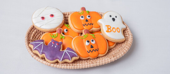 Fototapeta na wymiar Halloween funny Cookies in wooden basket. Trick or Threat, Happy Halloween, Hello October, fall autumn, Festive, party and holiday concept