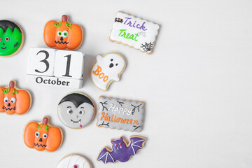 Halloween funny Cookies with 31 October calendar on white background. Trick or Threat, Happy Halloween, Hello October, fall autumn, Festive, party and holiday concept
