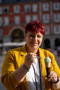 Smiling Mature Woman Eating Ice Cream