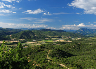 Fototapeta premium Panorama View To The Valley Val d'Asse In France On A Beautiful Summer Day With A Few Clouds In The Blue Sky