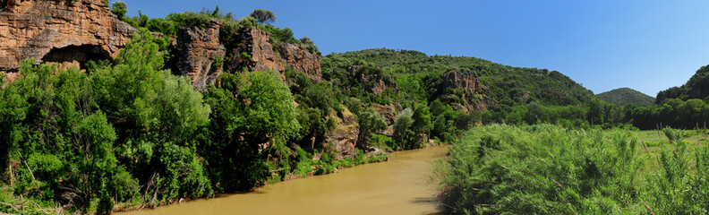 Fototapeta na wymiar Red Rocks At The River Argens Near Roquebrune In Provence France On A Beautiful Summer Day With A Clear Blue Sky