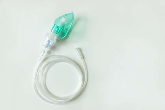 Medical oxygen mask isolated on white background. Medical inhaler, nebulizer, nebular. Asthma breathing treatment. Top view
