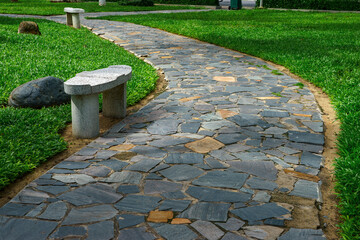 Curved stone walkway in the garden - 459695834