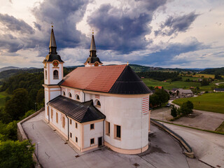 Fototapeta na wymiar Orthodox Church of Saint Mohorja in Fortunata in Zuzumberk ( Seisenberk ) Slovenia. Drone View