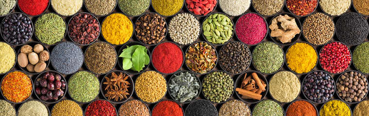 Spices and herbs background. Large set of seasoning top view. Colorful condiments for label prints or site caps