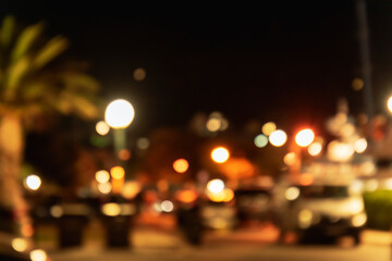 Illuminated street at night, abstract blurred background