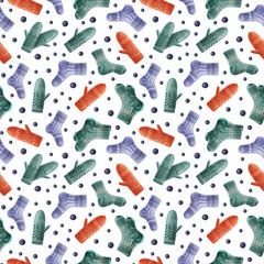 Seamless winter pattern with blue Christmas glass balls, knitted socks, and mittens on white background. Endless botanical background for wrapping paper, scrapbooking, gift wrapping, textile