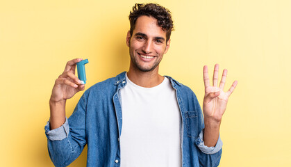 hispanic handsome man smiling and looking friendly, showing number four. asthma concept