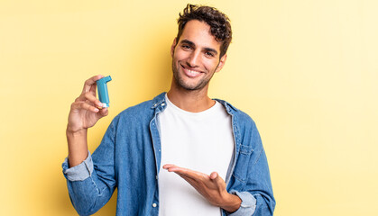 hispanic handsome man smiling cheerfully, feeling happy and showing a concept. asthma concept - obrazy, fototapety, plakaty