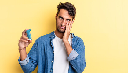 hispanic handsome man feeling bored, frustrated and sleepy after a tiresome. asthma concept