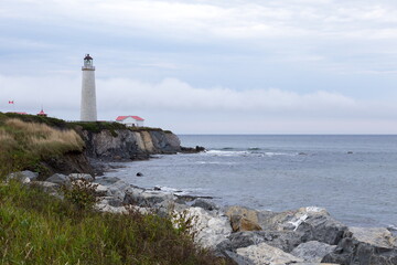 The 1858 lighthouse in Cap-des-Rosiers, the tallest in the country, seen during a grey morning, Gaspé, Quebec Canada