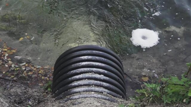 water flows from the drainage pipe. Super slow motion 1000 fps.
