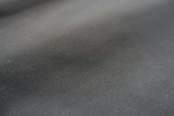 Closeup of simple thin black polyester fabric