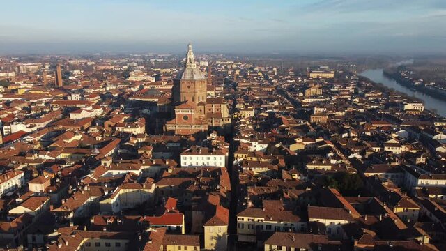 Drone view of the medieval city of Pavia in Italy : flyng over Ticino river and Old Town