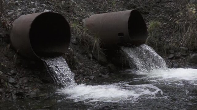water flows from the drainage pipe. Super slow motion 1000 fps.