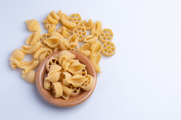 raw pasta on a white background Top view.