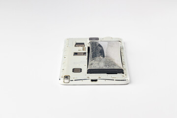 Cell phone battery swelling due to expiration. damaged swollen battery of mobile phone. Defective mobile phone battery.