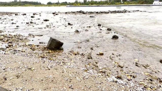 Flooding river creek after a flood water with a spring flood shows the forces of nature and the need for insurance against dangerous weather, hail storms, windstorms, cyclones, tornados and hurricanes
