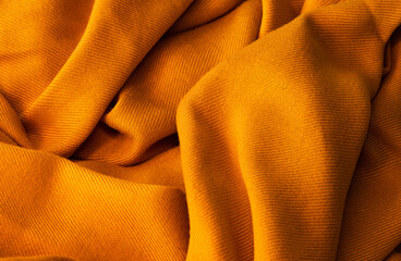 texture of a yellow woolen scarf. yellow woven background