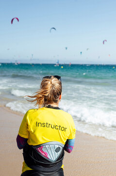 Female instructor looking at sea during vacation