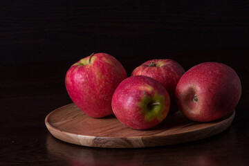 red apples on a wooden table