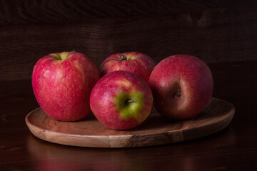 red apples on a wooden table