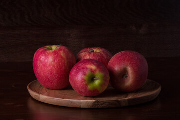 red apples on a wooden table