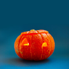 Halloween pumpkin on blue