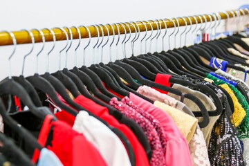 luxury colorful dresses are on hangers close up