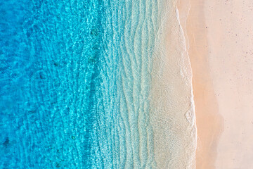 Beach and ocean as a background from top view. Azure water background from top view. Summer...