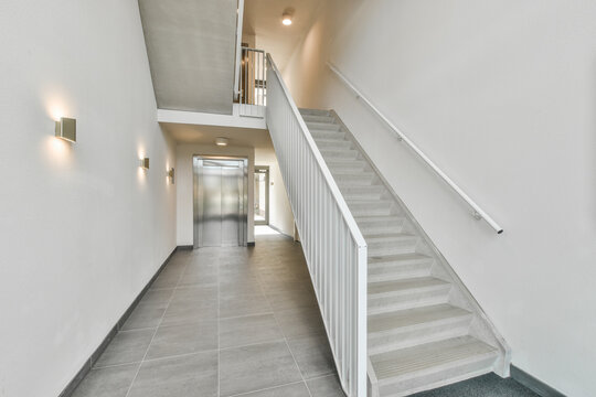 Interior of hall with stairs and elevator