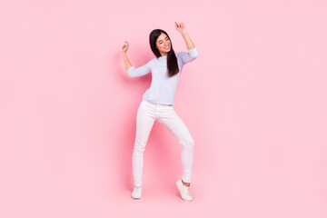 Fototapeta na wymiar Full length body size view of attractive dreamy cheerful girl dancing having fun rest pastime isolated over pink pastel color background