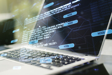 Double exposure of abstract programming language on laptop background, research and development concept