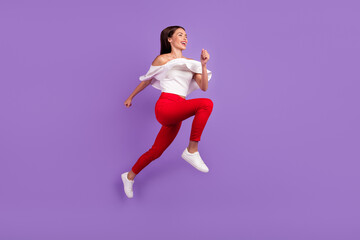 Fototapeta na wymiar Profile photo of sporty energetic lady jump run wear white blouse trousers footwear isolated purple color background
