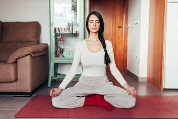 Caucasian woman in a variety of yoga postures meditating at home