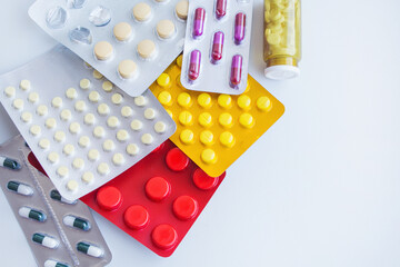 Different tablets, pills in foil blister packs, medications drugs