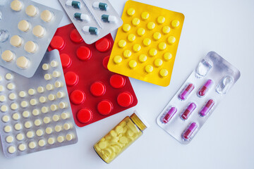 Different tablets, pills in foil blister packs, medications drugs