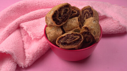 Indian traditional Snacks Bhakarvadi or Bakarvadi. Diwali snacks Bhakarwadi, selective focus.