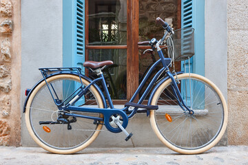 Fototapeta na wymiar Traditional vintage classic bike. Rural village in Mallorca, Spain