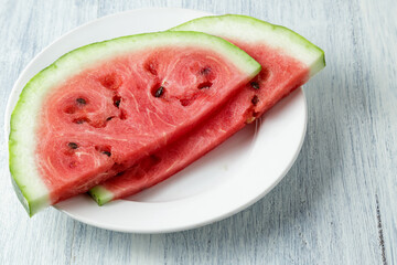 Waterelon, honey watermelon on wooden table background.